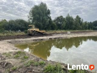 Transport niskopodwoziowy koparka szambo niwelacja piasek