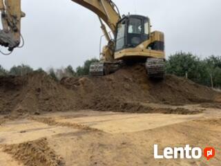 Transport niskopodwoziowy koparka szambo niwelacja piasek