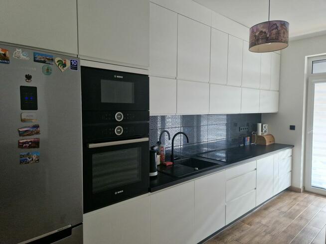 Nowe mieszkanie - taras, ogród, miejsca postojowe