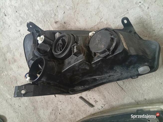 Reflektor prawy lewy Opel Corsa c lift