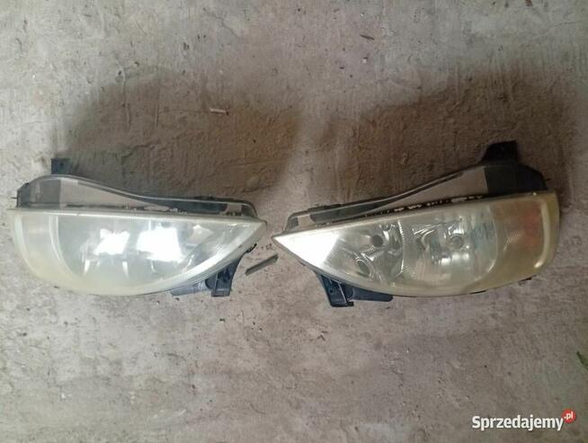 Reflektor prawy lewy Opel Corsa c lift