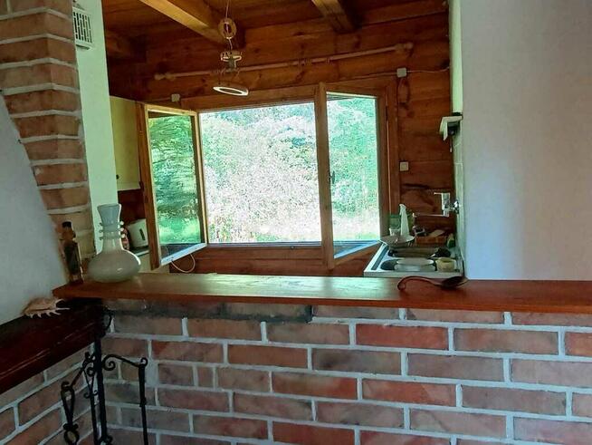 Łacha, drewniany dom na działce 1423 m