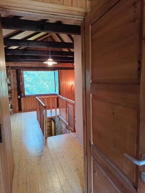 Łacha, drewniany dom na działce 1423 m