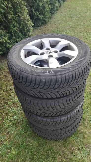 Felgi aluminiowe Peugeot r 16 z oponami zimowymi Nokian