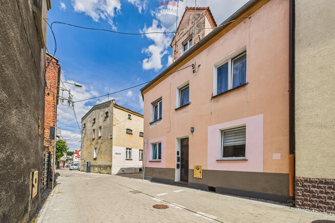 Kamienica: mieszkania, 2 lokale usługowe, 3 garaże