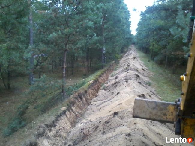 usługi koparką,koparko-ładowarką,wykopy,równanie,kucie