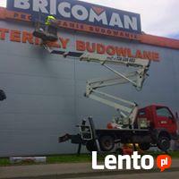 montaż banerów reklamowych, wynajem podnośnika koszowego