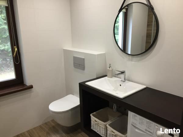 Dom całoroczny na Mazurach z własną plażą i pomostem.