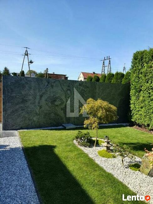 Elewacja z wielkich arkuszy forniru kamiennego Silver Grey