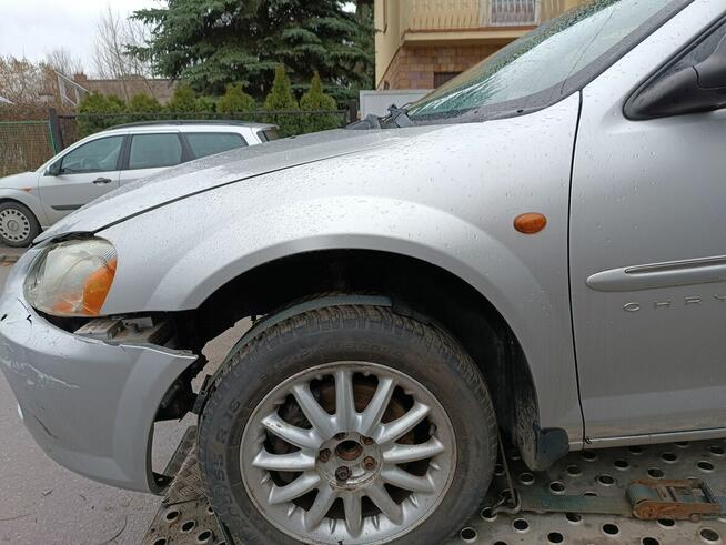 Chrysler Sebring 2 II sedan BŁOTNIK lewy prawy przód PS2