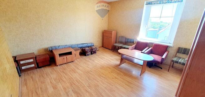 Duży dom jednorodzinny z częścią usługową