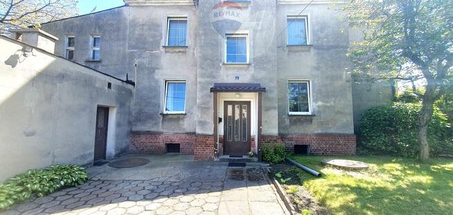 Duży dom jednorodzinny z częścią usługową