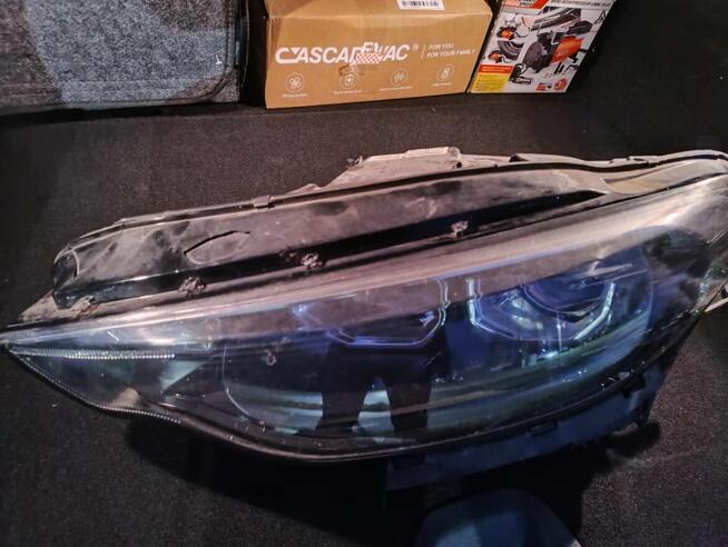 Reflektor lampa lewy przód