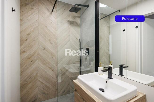 2 pokoje z balkonem zatopione w zieleni.