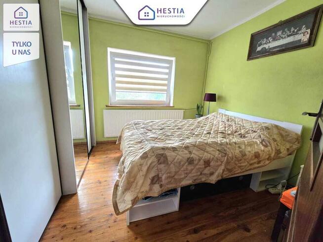 Mieszkanie na parterze z balkonem i garażem.