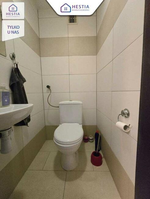 Mieszkanie na parterze z balkonem i garażem.