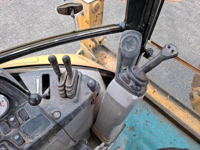 Koparko ladowarka Caterpillar