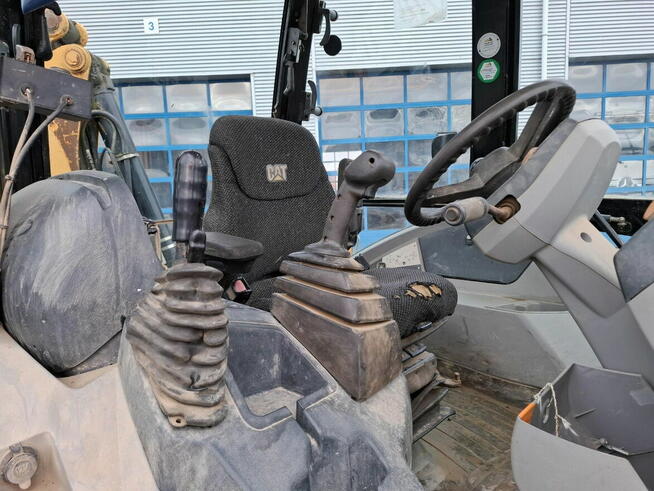 Koparko ladowarka Caterpillar