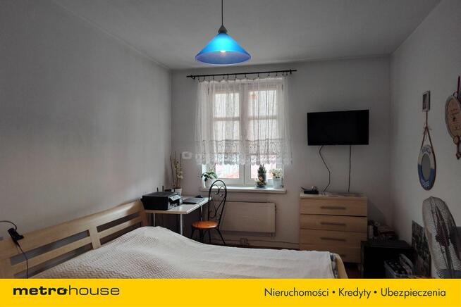 Trzypoziomowa kamienica z lokalem handlowym.