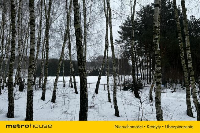 Służewo, działka ze stawem, częściowo zadrzewiona.