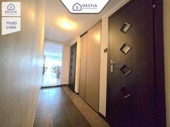 Mieszkanie na parterze z balkonem i garażem.