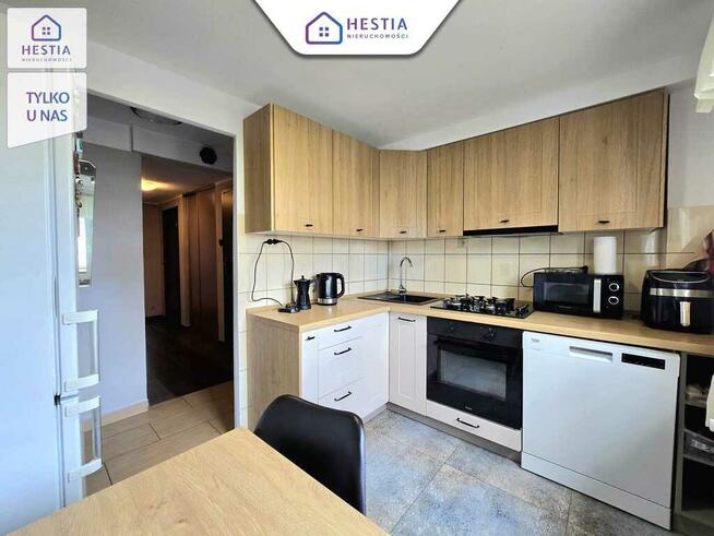 Mieszkanie na parterze z balkonem i garażem.