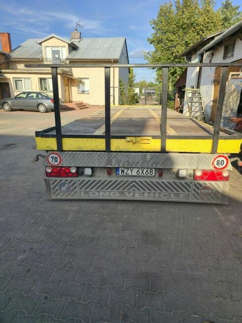 Przyczepa niskopodwoziowa 24tDMC z najazdami i burtami