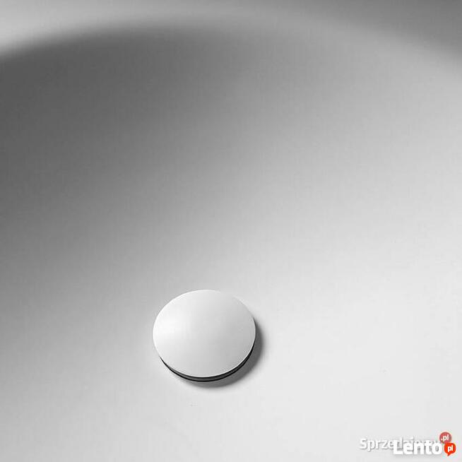 Owalna umywalka łazienkowa wygięta bezpośrednio z blatu