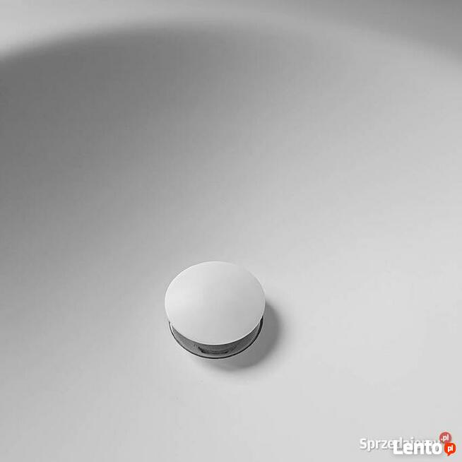 Owalna umywalka łazienkowa wygięta bezpośrednio z blatu