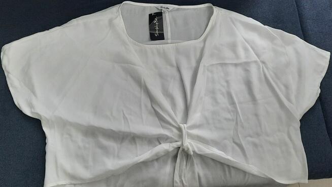48 Bluzka damska biała z wiązaniem z przodu lekko prześwituj