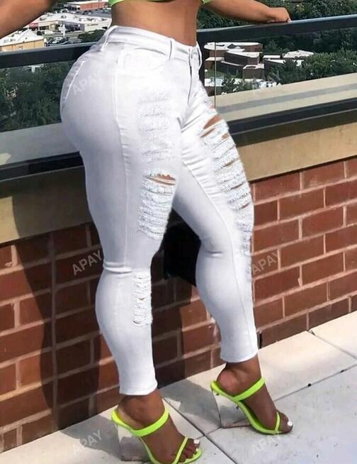 Damskie obcisłe dżinsy z wycięciami, z przetarciami i kiesze