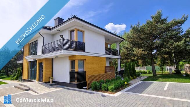 Modernistyczny dom nad jeziorem z funkcją pensjonatu