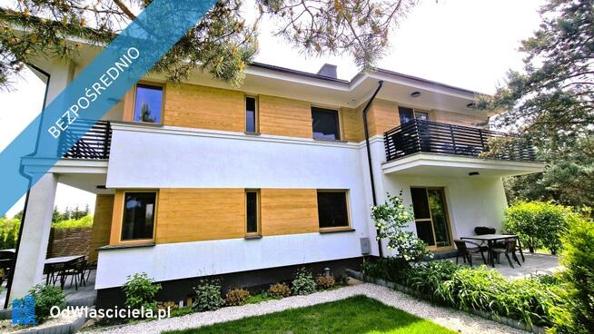 Modernistyczny dom nad jeziorem z funkcją pensjonatu