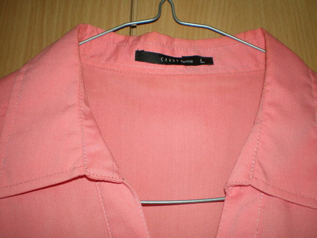 Bluzka damska w rozmiarze L, w kolorze różowym.