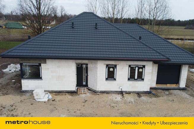 Dom parterowy wolnostojący - pompa ciepła, kominek