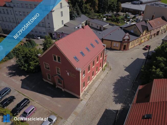 Działka zabudowana budynkiem magazynowo administracyjnym