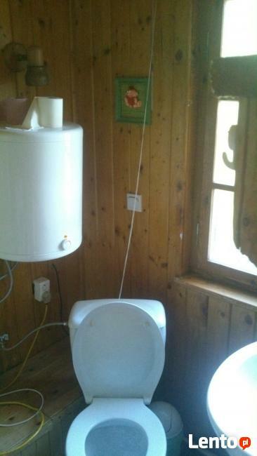 domek drewniany nad jeziorem Mazury