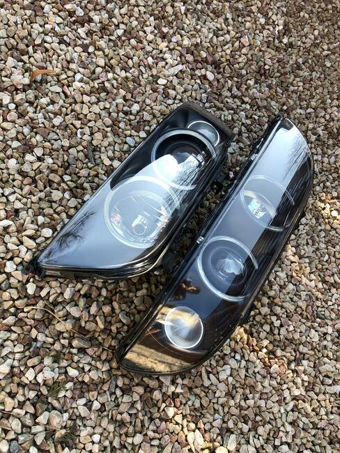 Reflektory E39 FL lift XENON HELLA BLACK lewy + prawy *NOWE*