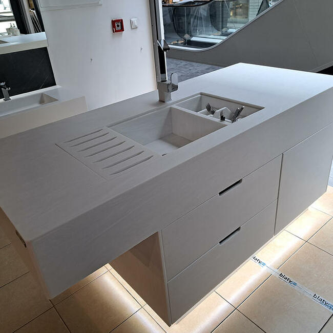 Wyspa kuchenna wykonana z kompozytu ze zintegrowanym zlewem