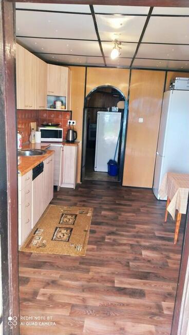 Dom w Augustowie z linią brzegową jeziora