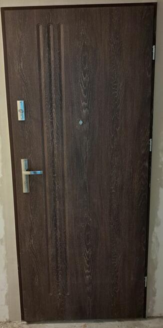 Drzwi drewniane metalowe do bloku z montażem Poznań OD RĘKI