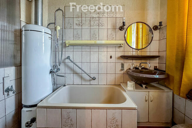 Dom ciekawej w zabudowie szeregowej z ogródkiem