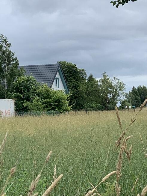 Sprzedam nad morzem działkę z budynkiem i gotowym projektem