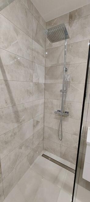 Nowoczesna kawalerka z ogrodowym tarasem i miejscem postojow