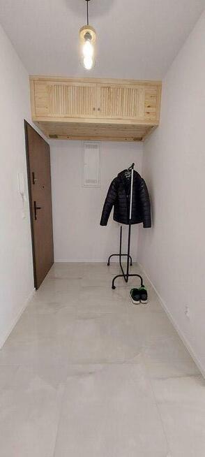 Nowoczesna kawalerka z ogrodowym tarasem i miejscem postojow