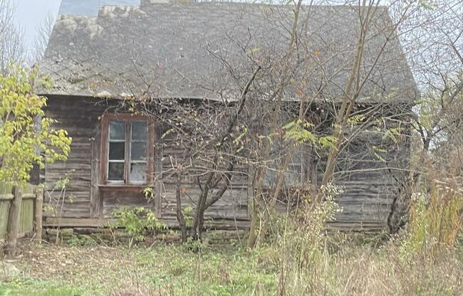 Sprzedam działkę z zabudowaniami