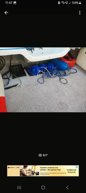 Łódź motorowa z przyczepą