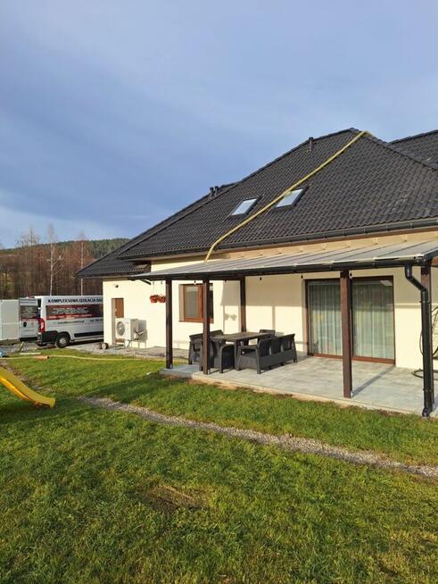 Ocieplanie celulozą i naprawa izolacji dachu po kunie