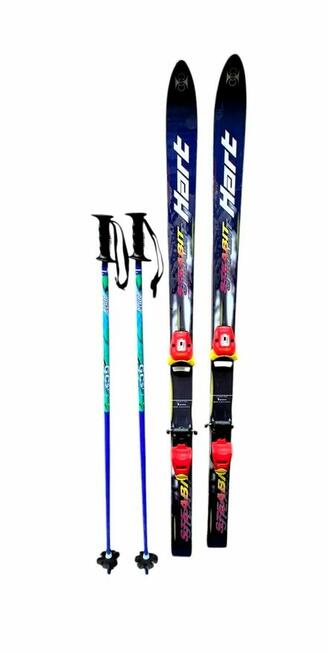 Narty zjazdowe z wiązaniami Tyrolia i kijkami Elan