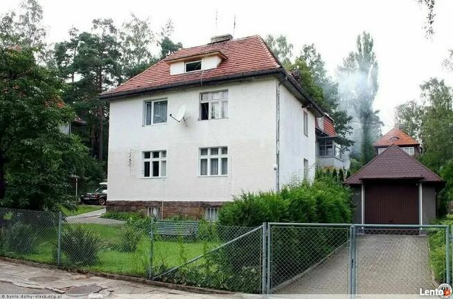 Połowe domu z ogrodem i garazem